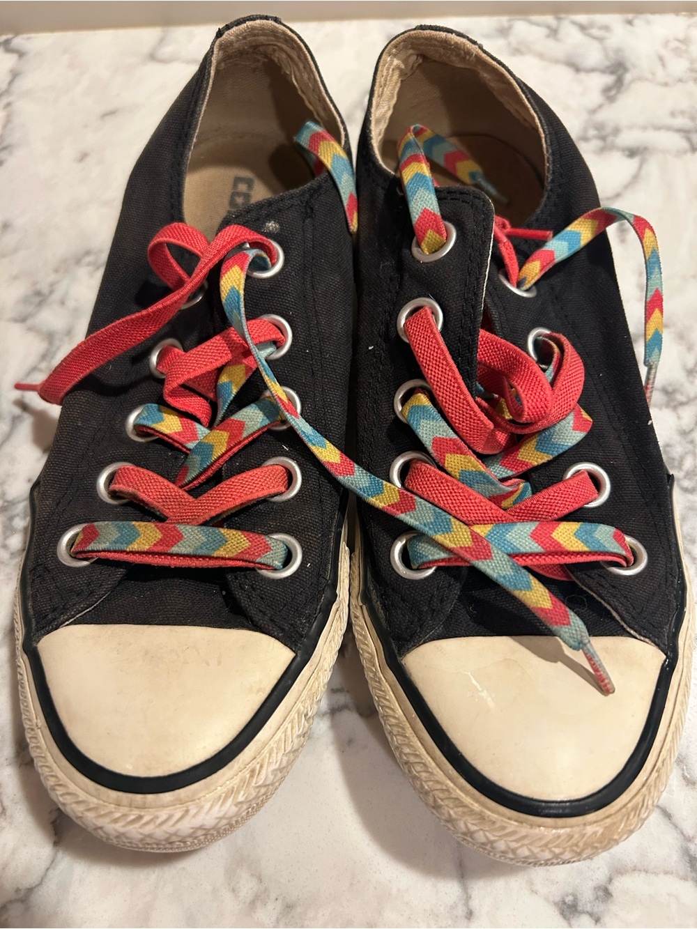 Chuck Taylor Converse All Stars black sneakers.